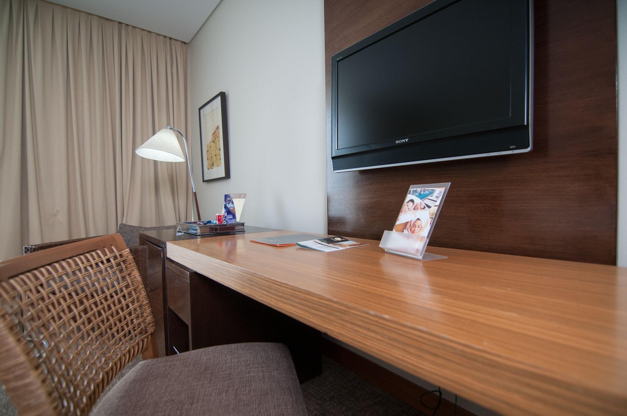 Enjoy Coquimbo Hotel Buitenkant foto A television in a hotel room